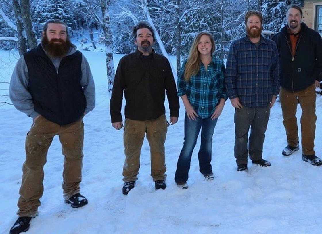 Chase and his TV show crew standing in a line on snow Chase and his TV show crew standing in a line on snow