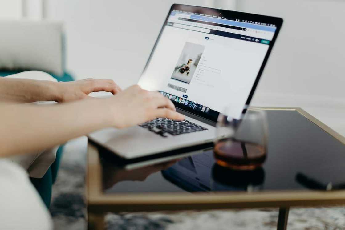 A woman typing on the laptop A woman typing on the laptop