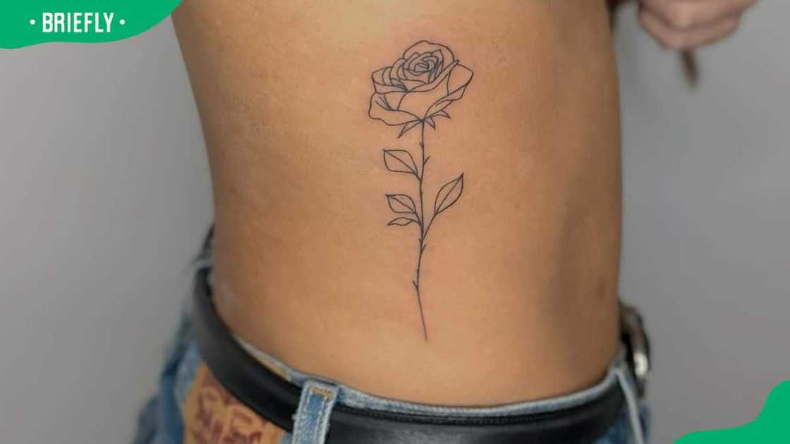 Rose tattoo on ribs Rose tattoo on ribs