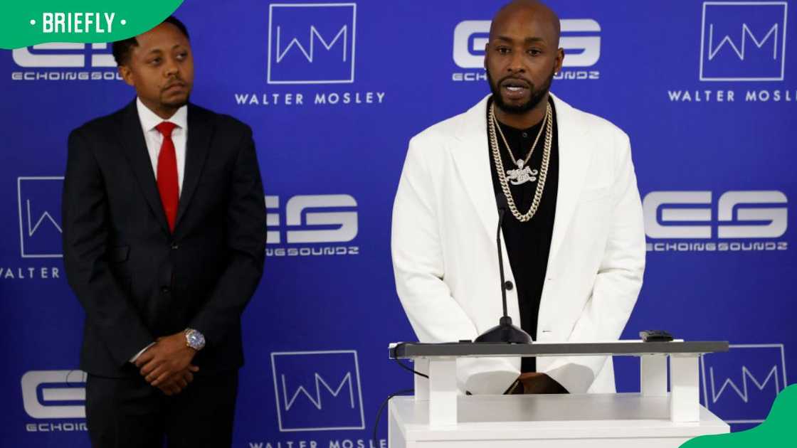 Emanuel and his lawyer, Walter Mosley, during a 2021 press conference Emanuel and his lawyer, Walter Mosley, during a 2021 press conference