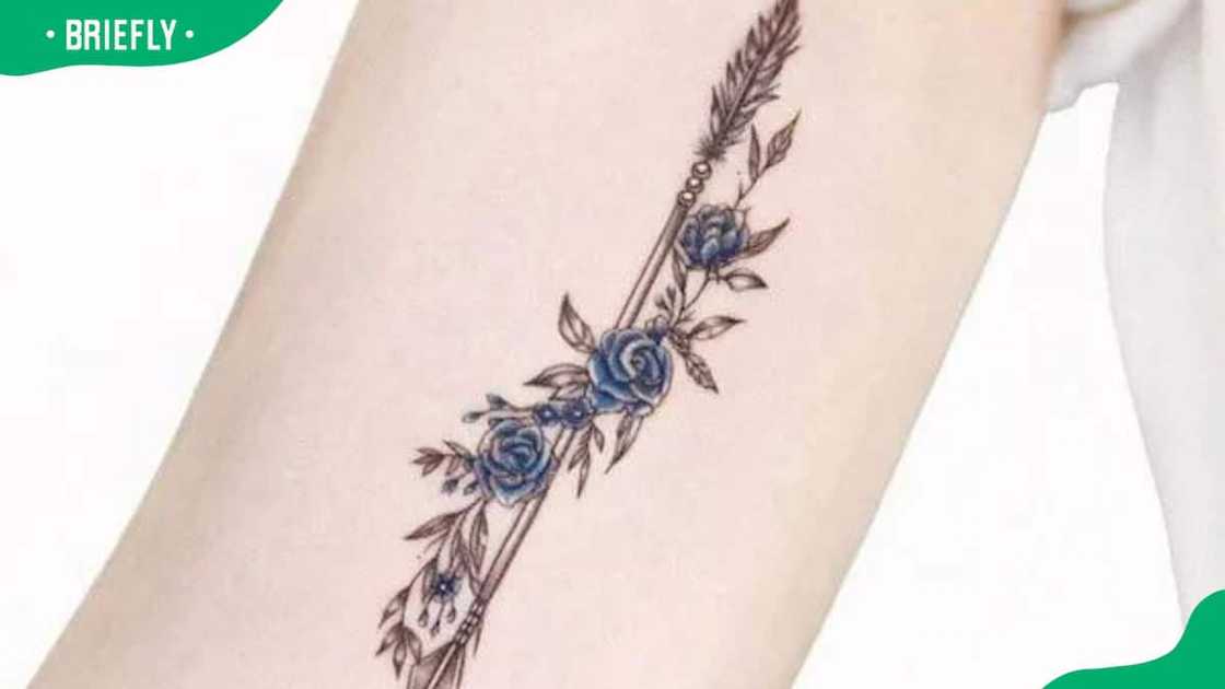Rose and arrow bicep tattoo Rose and arrow bicep tattoo