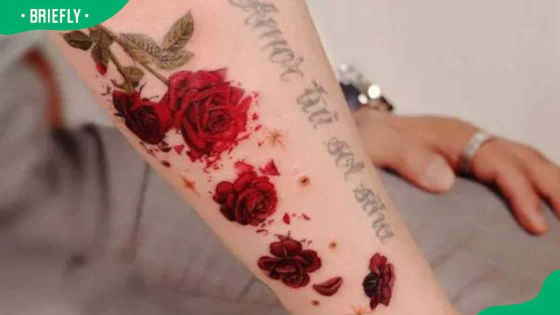 Rose and petals forearm tattoo Rose and petals forearm tattoo