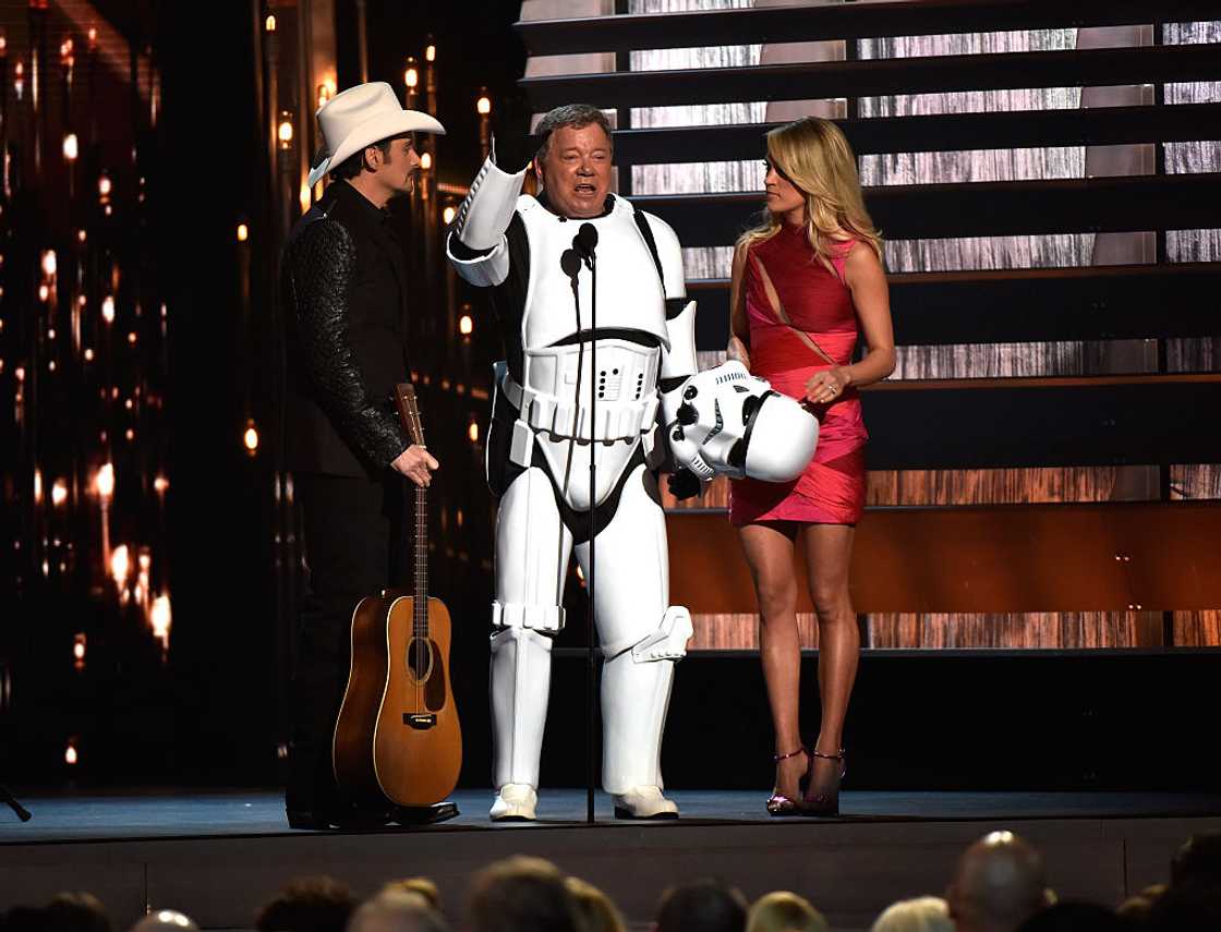 Co-host Brad Paisley, actor William Shatner, and co-host Carrie Underwood onstage at the 49th annual CMA Awards Co-host Brad Paisley, actor William Shatner, and co-host Carrie Underwood onstage at the 49th annual CMA Awards