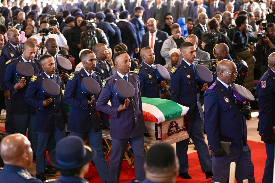 Members of the South African Police Service carried the coffin of Constable Keamogetswe Buys Members of the South African Police Service carried the coffin of Constable Keamogetswe Buys